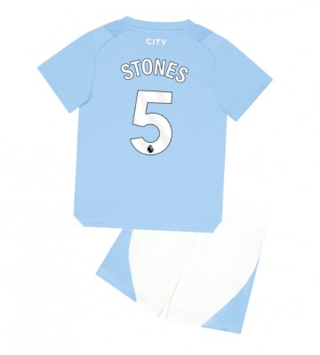 Manchester City John Stones #5 Primera Equipación Niños 2023-24 Manga Corta (+ Pantalones cortos)